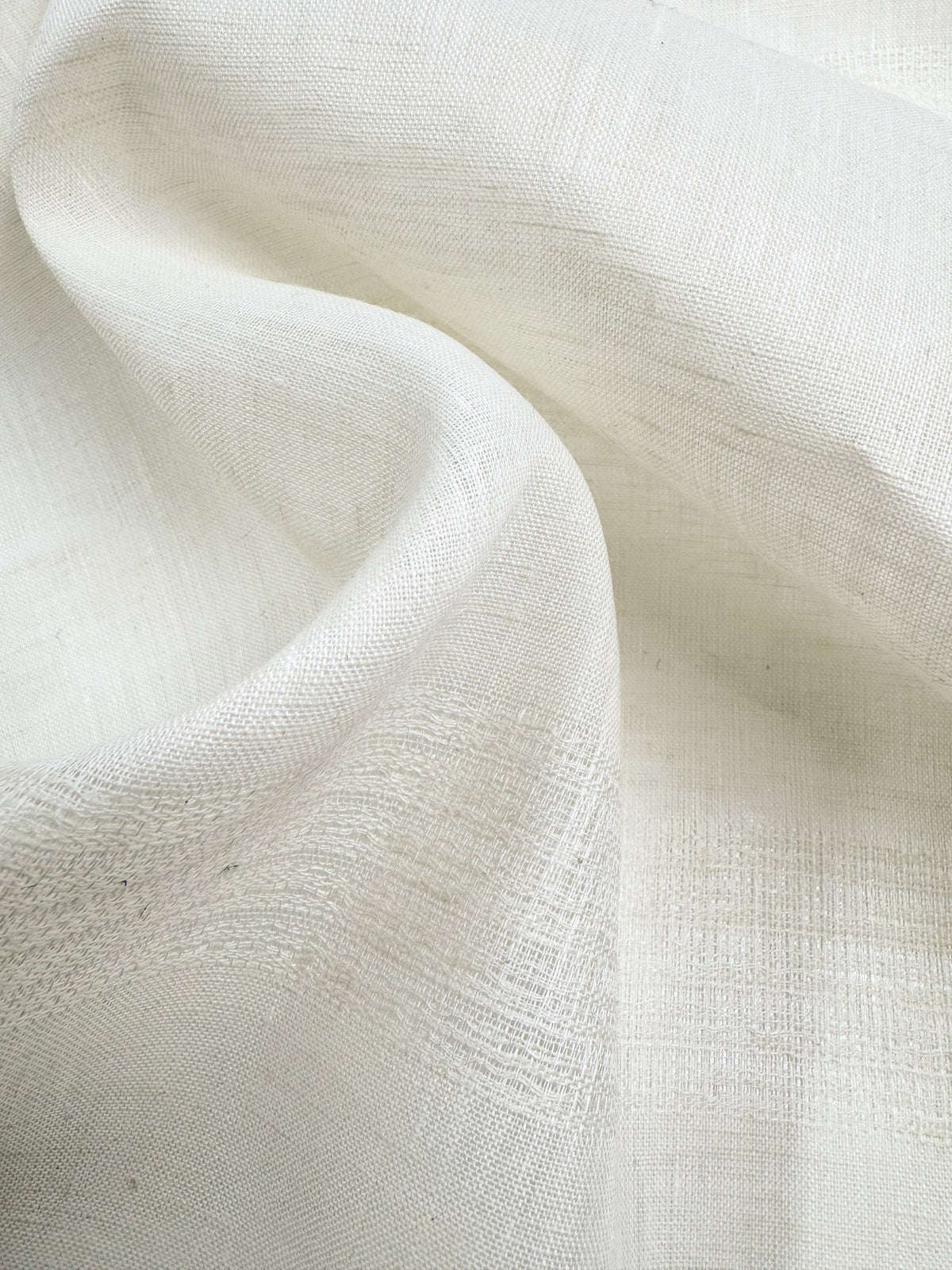 Close-up of cream linen showing its natural weave and texture